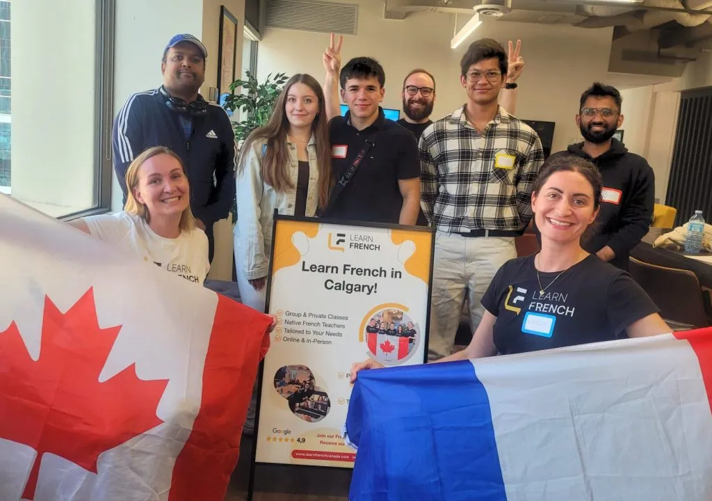 Launching Learn French in Calgary, students with Canadian and French flags