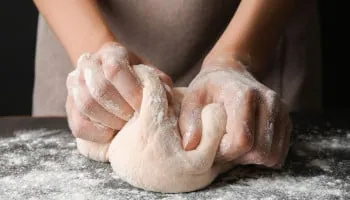 Mettre la main à la pâte, French expression for pitching in, illustrated