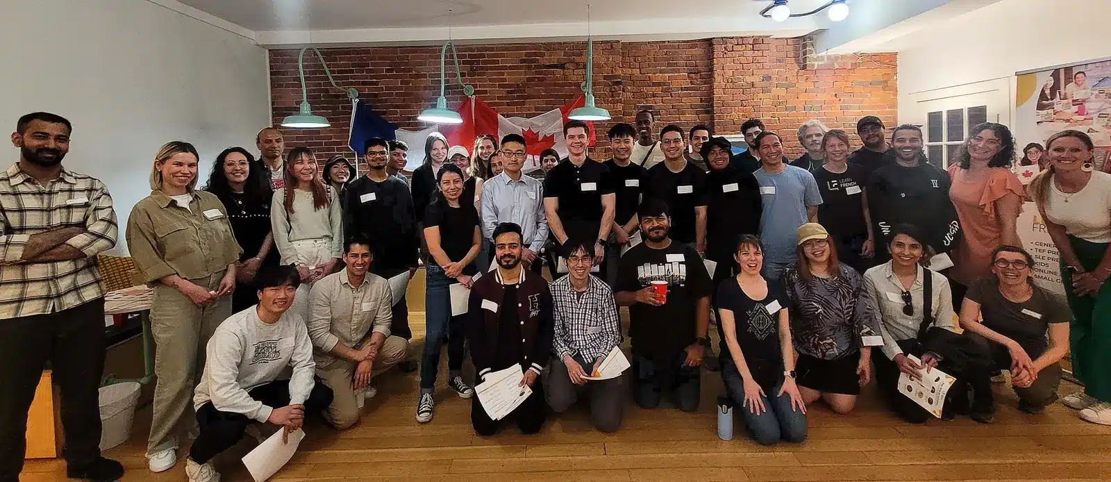 TEF & TCF Compréhension Orale: Listening Guide & CLB 7 1 TEF TCF compréhension orale — students celebrating with certificates after passing their French listening exam at Learn French in Vancouver